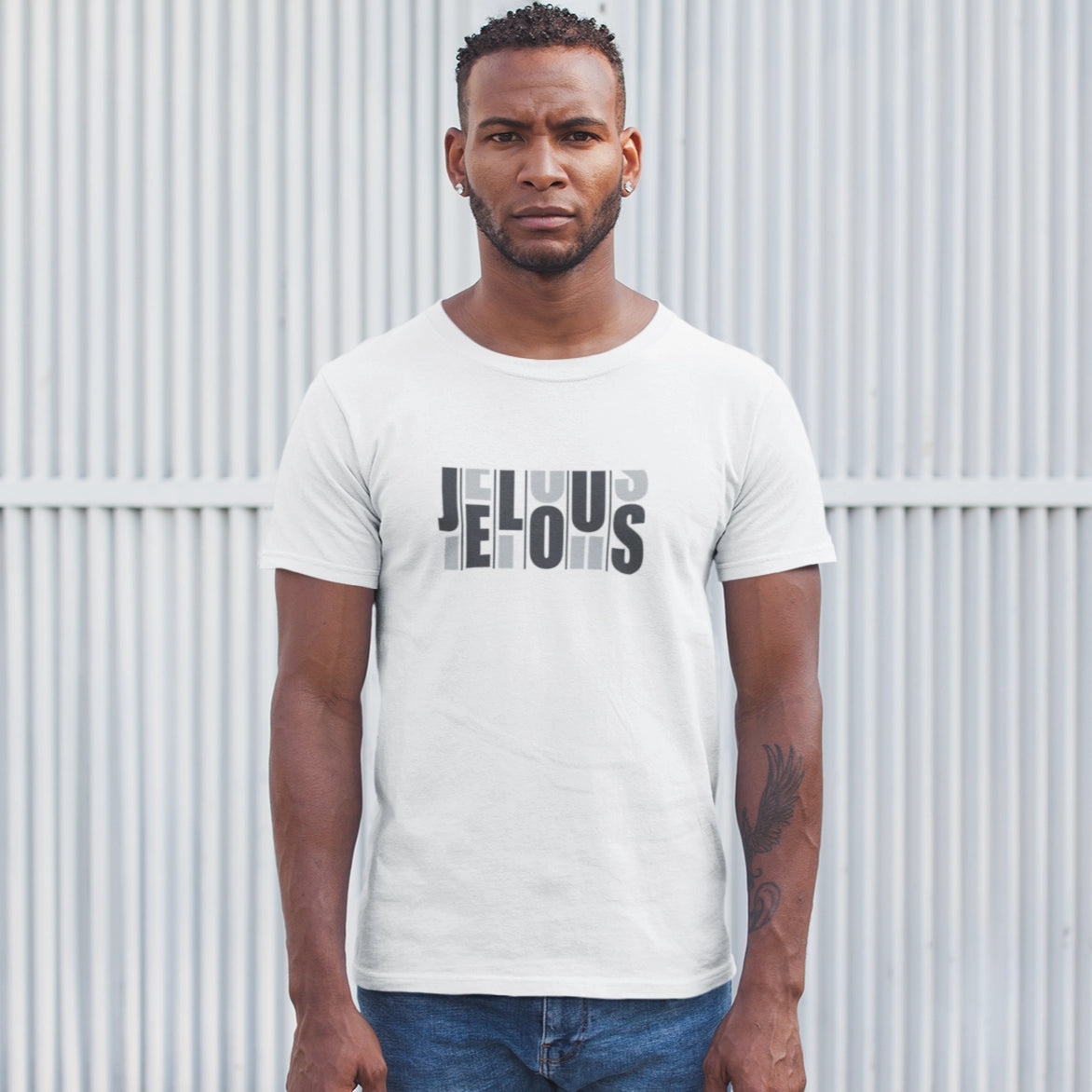 Man wearing a blue JELOUS Grid white Tee with bold white print, casual short-sleeve 100% cotton regular fit t-shirt for men